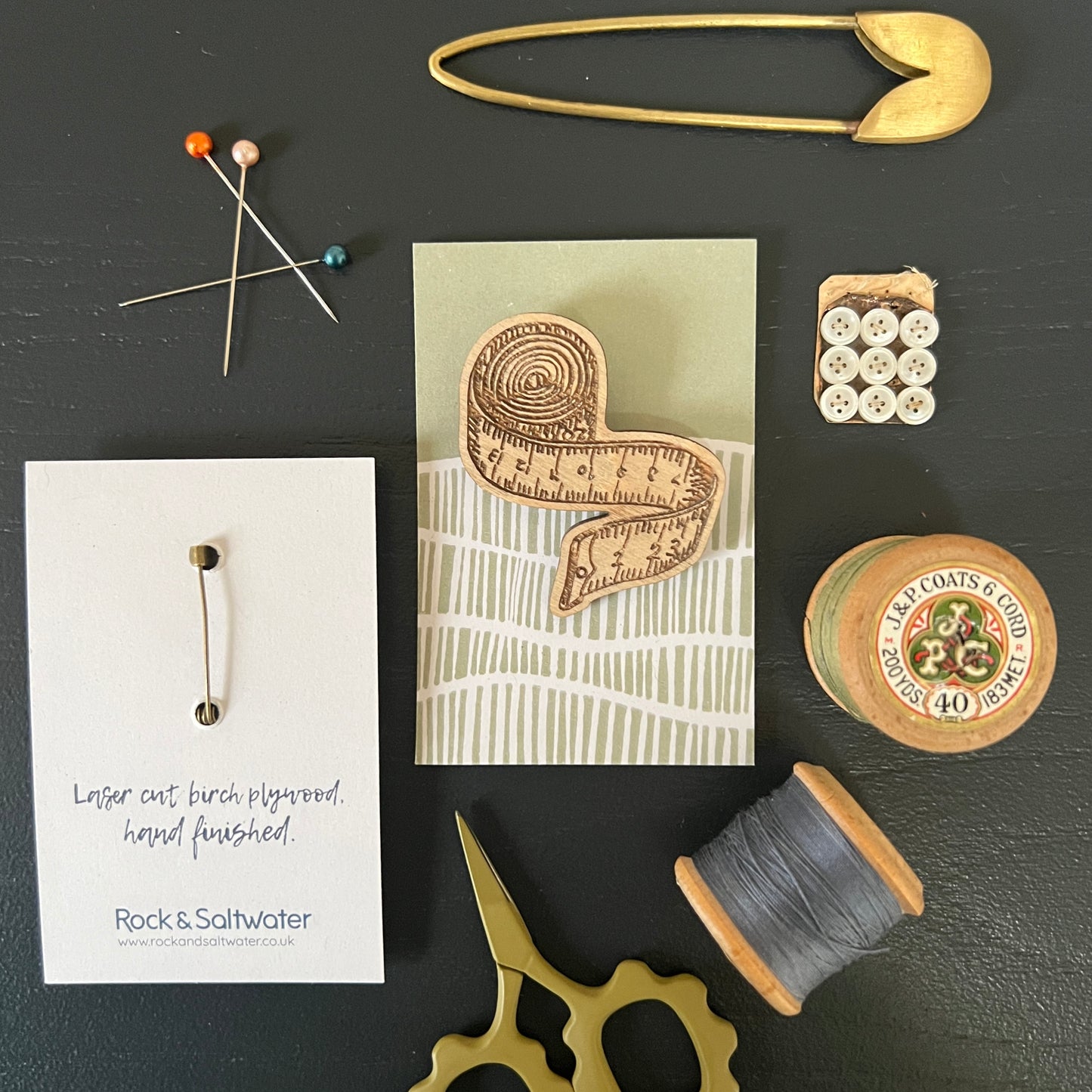 Tape measure etched wooden brooch