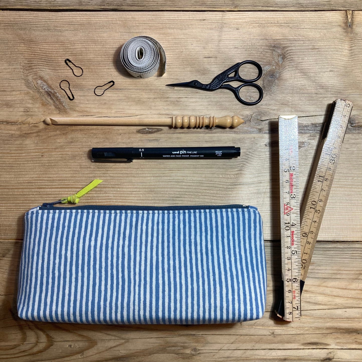 Blue stripe boxed zipped pouch with leather zip pull