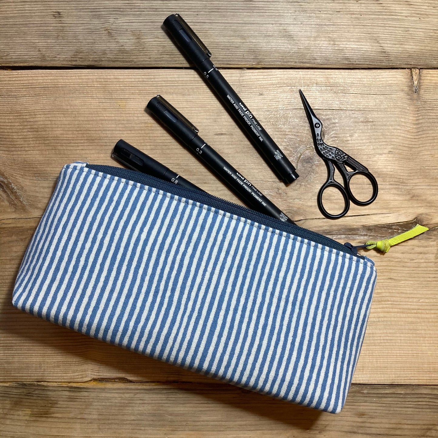 Blue stripe boxed zipped pouch with leather zip pull