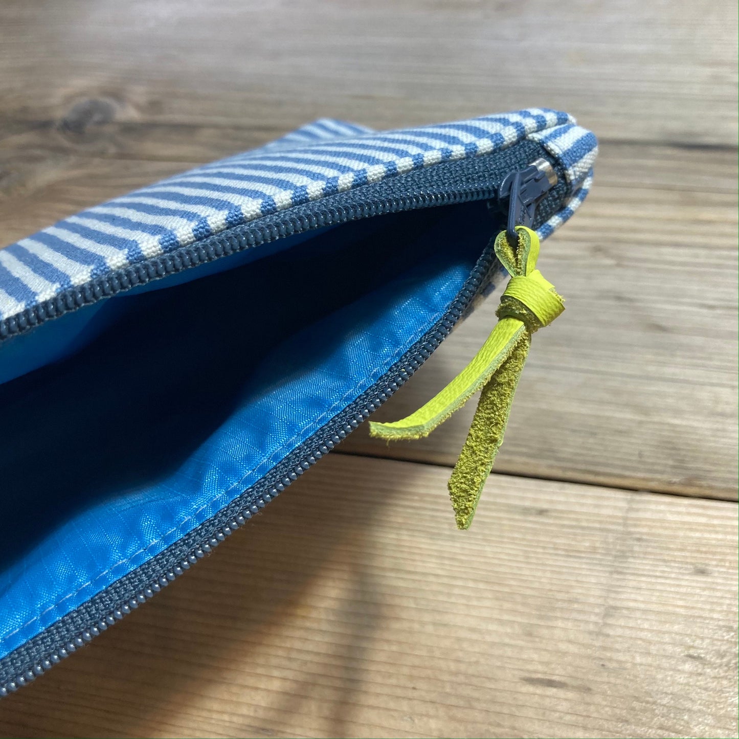 Blue stripe boxed zipped pouch with leather zip pull
