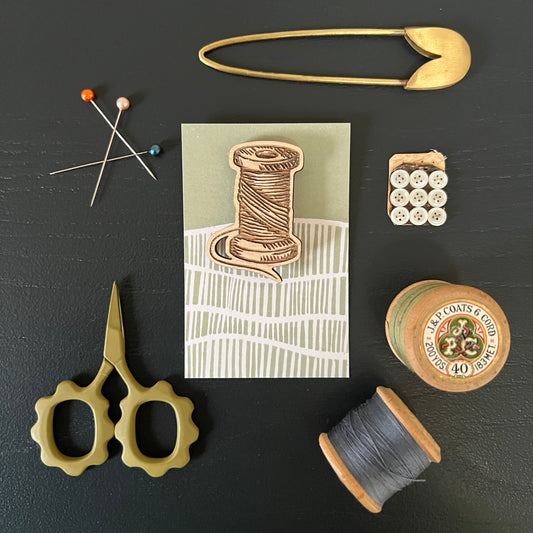 Cotton reel etched wooden brooch