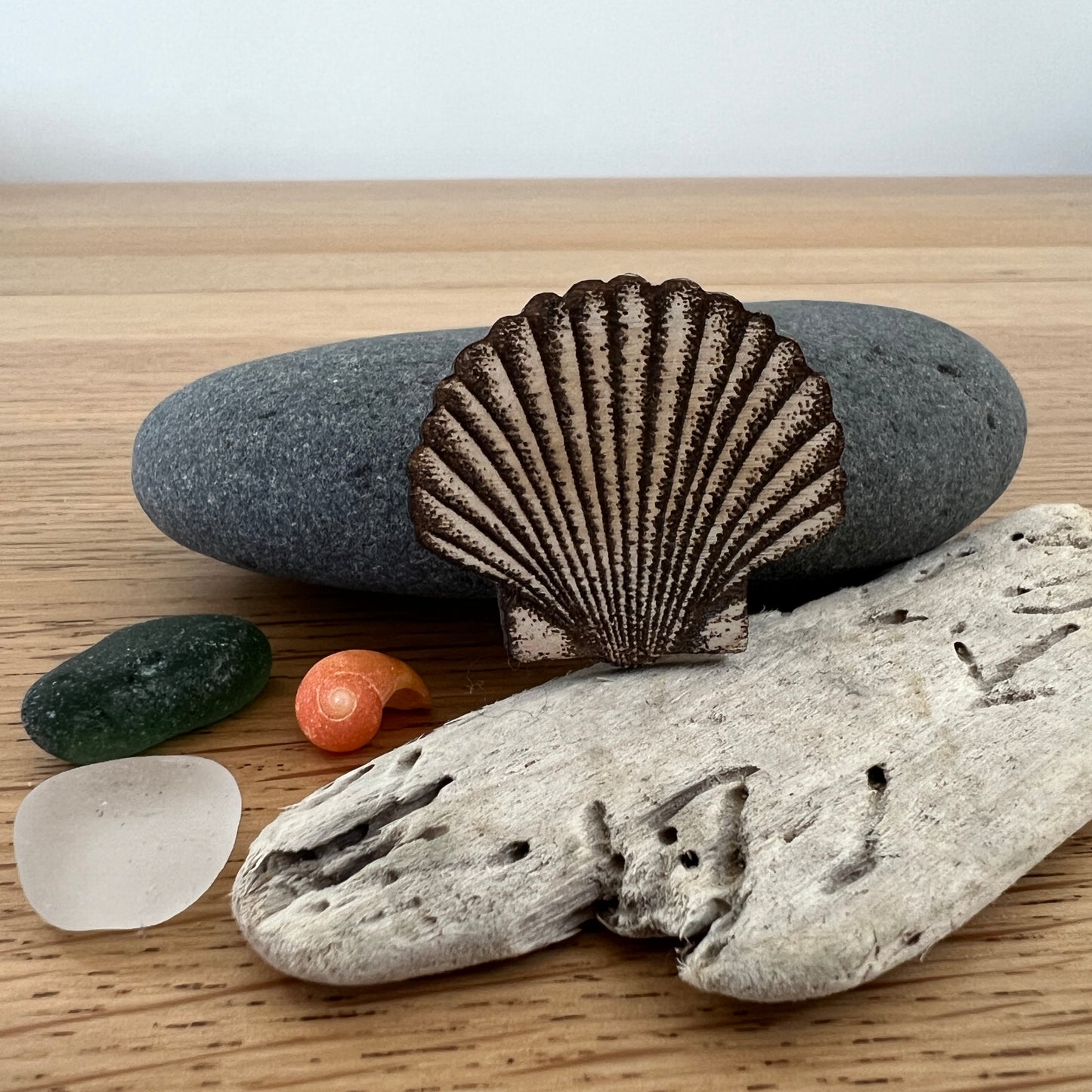 Shell etched wooden brooch