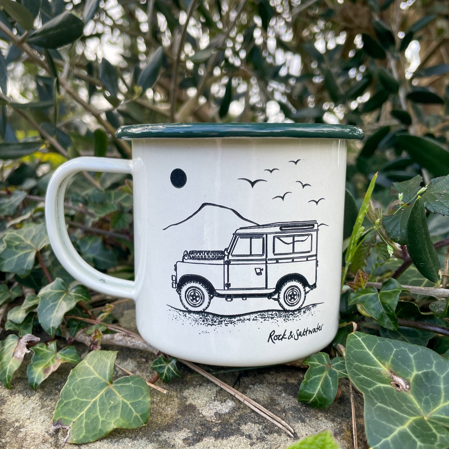 Land Rover side view with mountain enamel mug