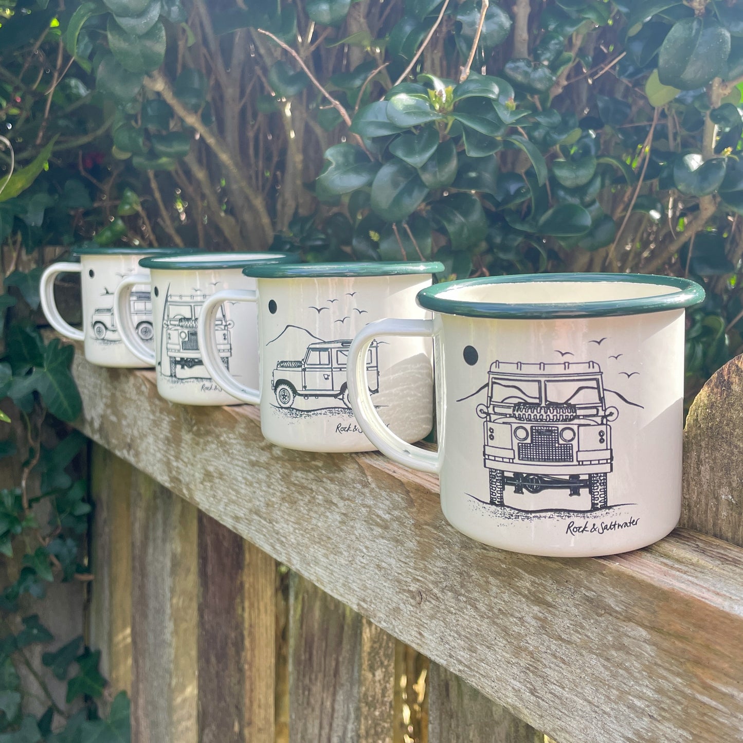 Land Rover front view with mountain enamel mug