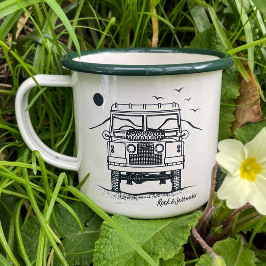 Land Rover front view with mountain enamel mug