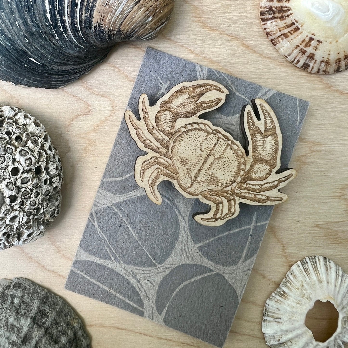 Crab etched wooden badge
