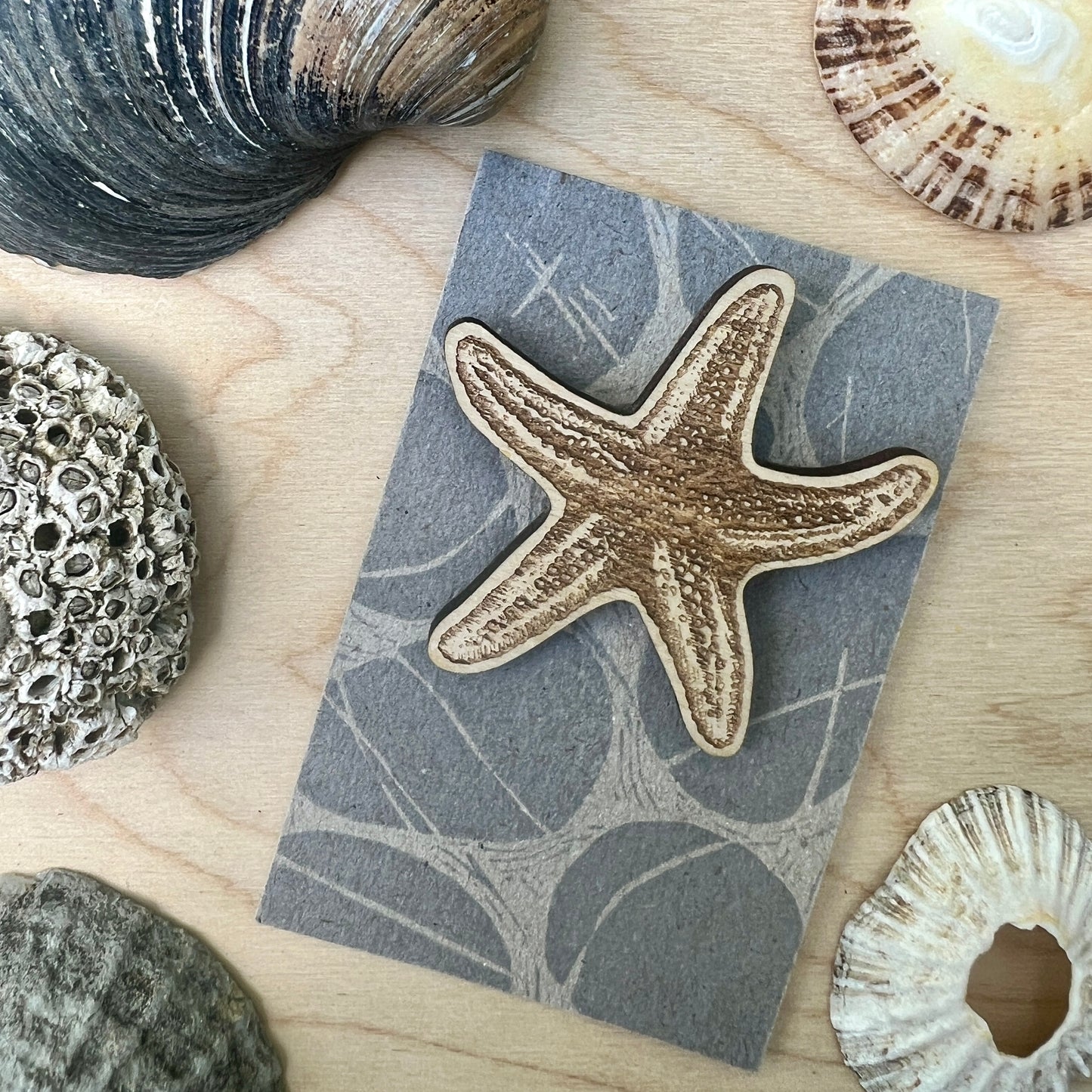 Starfish etched wooden badge